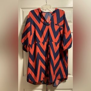 Orange and Blue knee length dress. Adjustable tie in the front.